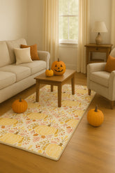 Machine washable rug with yellow pumpkins and blush pink florals.
